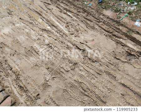 dirty and muddy road in rural village of India dirty and muddy road in rural village of India 119905233