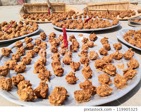 Urad Dal vadi or mong dal warian masala food drying in sunlight. it is Indian favourite food Urad Dal vadi or mong dal warian masala food drying in sunlight. it is Indian favourite food 119905325