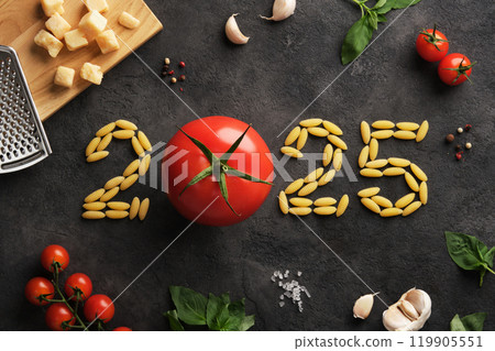 2025 figures with Italian ingredients on dark stone background, tomatoes, pasta, basil and parmesan 119905551