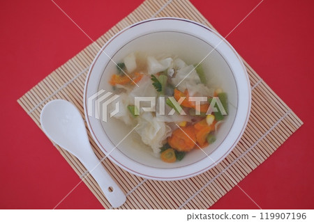 A bowl of vegetable soup on a table 119907196