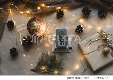 Christmas composition. New Year festive background with spruce branches and adecorations. New year's date. Flat lay, top view 119907868
