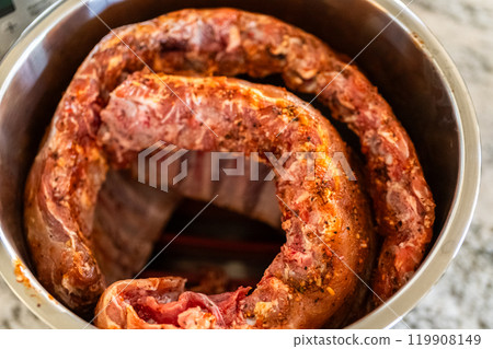 In a sleek modern kitchen, were adding an extra layer of flavor to succulent baby back ribs by infusing them with a medley of spices in a multicooker-a mouthwatering feast in the making. In a sleek modern kitchen, were adding an extra layer of flavor to succulent baby back ribs by infusing them with a medley of spices in a multicooker-a mouthwatering feast in the making. 119908149