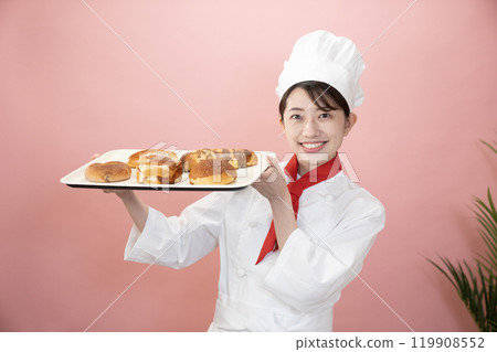 Baker with pink bag and freshly baked bread Baker with pink bag and freshly baked bread 119908552