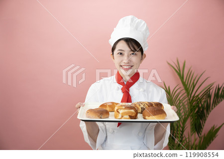 Baker with pink bag and freshly baked bread 119908554