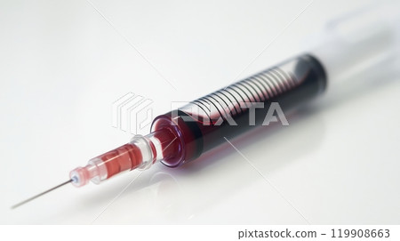 This close-up shows a syringe containing red liquid, illustrating the accuracy of measurements and the design of the needle for medical applications This close-up shows a syringe containing red liquid, illustrating the accuracy of measurements and the design of the needle for medical applications 119908663