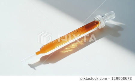 The dropper, filled with golden liquid, sits quietly on a bright surface, reflecting light in a tranquil environment, perfect for wellness or beauty applications The dropper, filled with golden liquid, sits quietly on a bright surface, reflecting light in a tranquil environment, perfect for wellness or beauty applications 119908678