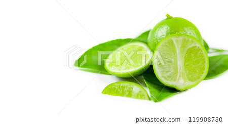 Whole limes and lime halves placed on a white background, highlighting the freshness and vibrant color of the fruit. 119908780