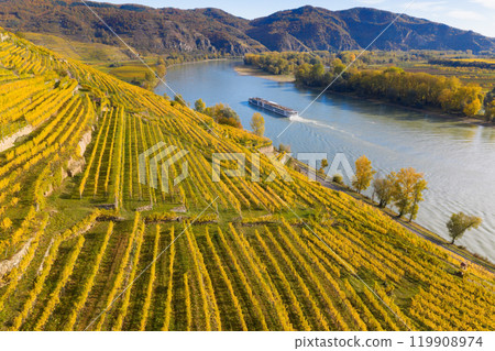 Autumn panorama of Wachau valley (Unesco world heritage site) with ships on Danube river near the Weissenkirchen village in Lower Austria, Austria Autumn panorama of Wachau valley (Unesco world heritage site) with ships on Danube river near the Weissenkirchen village in Lower Austria, Austria 119908974
