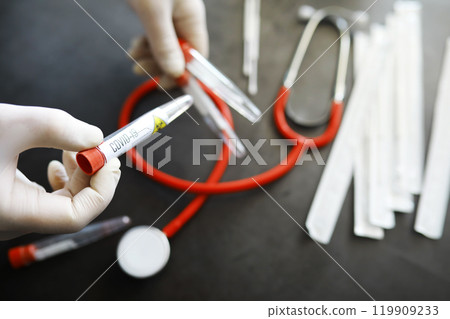 Medical background. PCR test for covid. Cotton swabs for taking a smear on the table. 119909233