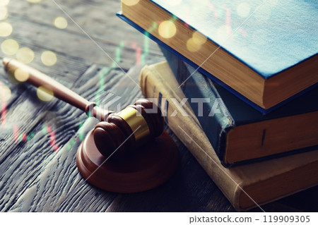 Wooden judge gavel and legal book on wooden table Wooden judge gavel and legal book on wooden table 119909305
