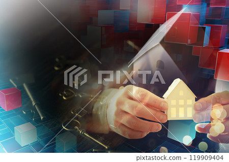 Real estate concept. Paper house and keys on a wooden background. Real estate concept. Paper house and keys on a wooden background. 119909404