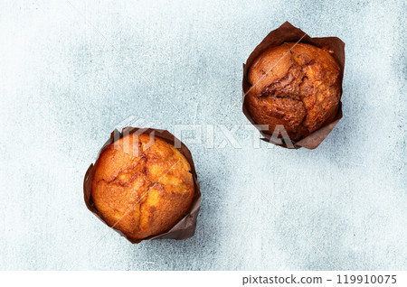 Sweet Baked vanilla muffins ( cupcake )  . Top view 119910075