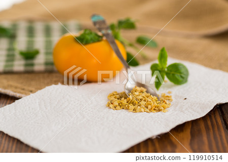 yellow pepper seeds on wooden table yellow pepper seeds on wooden table 119910514