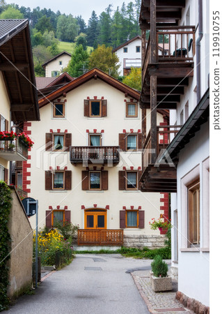Ortisei, Italy houses and mountains in summer 119910755