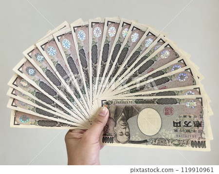 Hand holding 200,000 yen Hand holding 200,000 yen 119910961