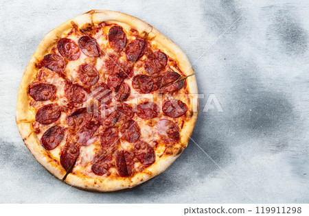 Pizza pepperoni fast food . Top view on rustic background 119911298