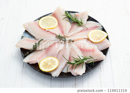 Raw tilapia fillet photography . Top view 119911319