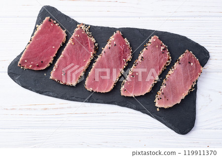 Sliced tuna steak with sesame photography . Top view 119911370