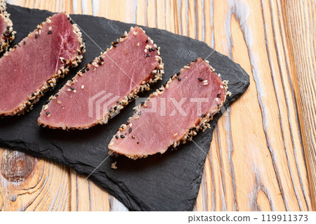 Sliced tuna steak with sesame photography . Top view Sliced tuna steak with sesame photography . Top view 119911373