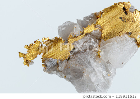 macro mineral stone metal gold in quartz on a white background macro mineral stone metal gold in quartz on a white background 119911612