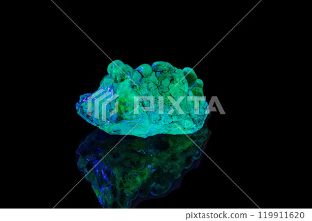 macro mineral stone opal under ultraviolet light on a black background 119911620