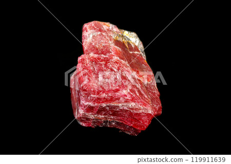 macro mineral Rhodonite stone on a black background macro mineral Rhodonite stone on a black background 119911639