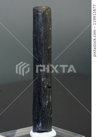 macro mineral stone Ilvaite on a gray background 119911677