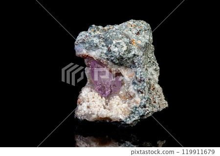 macro mineral amethyst stone in rock on a black background macro mineral amethyst stone in rock on a black background 119911679