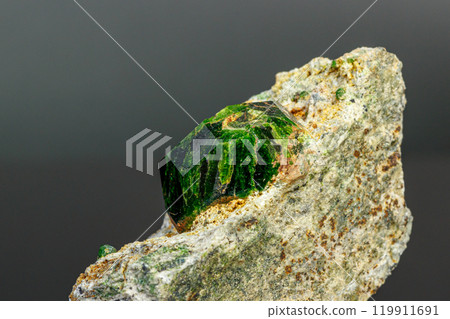 macro mineral stone Andradite on a black background 119911691