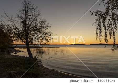 Golden sunset over Lake Sniardwy. Landscape of Masuria in Poland. Golden sunset over Lake Sniardwy. Landscape of Masuria in Poland. 119911925