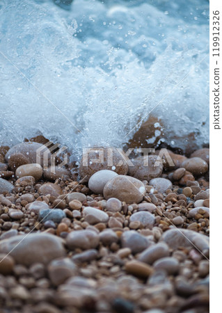 sea wave rolling on the rocks 119912326