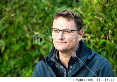 Portrait of a 45 yo white man outdoors in Koekelberg, Brussels, Belgium 119913044