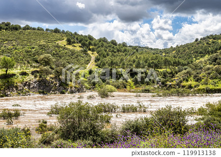Hiking along the river Vascao located near Gioes in the Algarve region in Portugal. 119913138