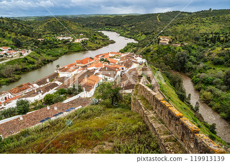 View of the river Guadiana and the village of Mertola. Alentejo Region. Portugal 119913139