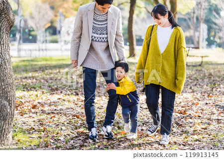 Image of a happy family spending time in the park Image of a happy family spending time in the park 119913145