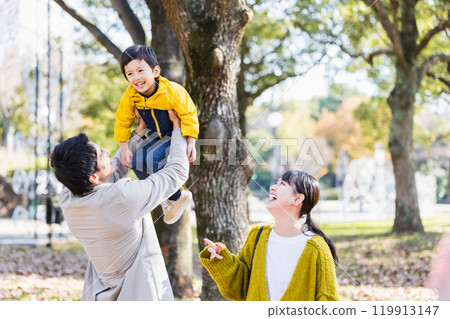Family playing with children in autumn park Family playing with children in autumn park 119913147