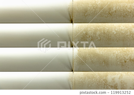 Residential Window Shades Showing the Before and After of a Good Cleaning - One Side Clean and One Side Dirty. 119913252