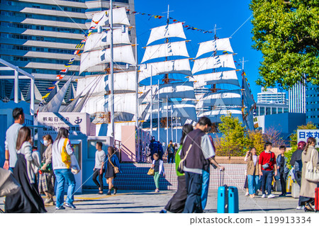 Yokohama cityscape in Japan, with a view of the Nippon Maru with full sails and the Yokohama Landmark Tower (far left) on November 3rd Yokohama cityscape in Japan, with a view of the Nippon Maru with full sails and the Yokohama Landmark Tower (far left) on November 3rd 119913334