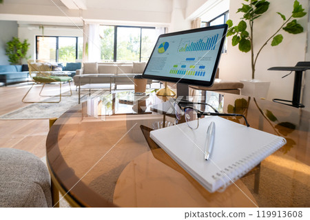 Tablet placed on table 119913608