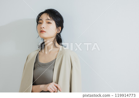 A woman standing in the office A woman standing in the office 119914773