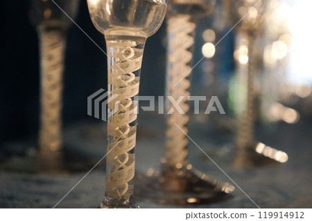 Unusual glasses with beautifully designed handles 119914912