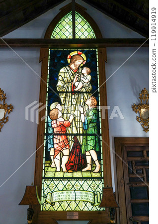Beautiful stained glass in a European church Beautiful stained glass in a European church 119914919