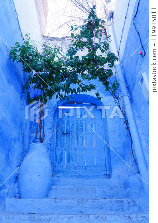 Door at the top of a staircase in Chefchaouen's blue city 119915011