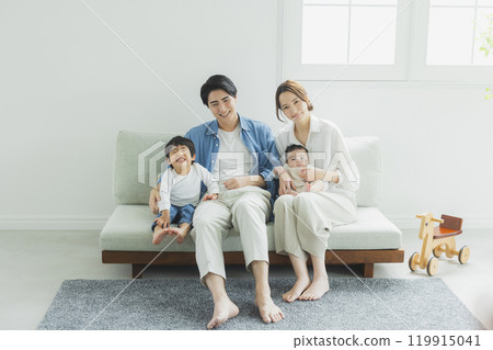 Young family, parents and children, living room Young family, parents and children, living room 119915041