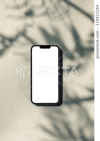 A smartphone placed in a space shaded by a potted plant A smartphone placed in a space shaded by a potted plant 119915264