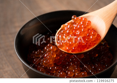 Close-up of salmon roe marinated in soy sauce served in a rice bowl Close-up of salmon roe marinated in soy sauce served in a rice bowl 119916275