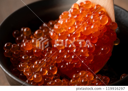 Close-up of salmon roe marinated in soy sauce served in a rice bowl Close-up of salmon roe marinated in soy sauce served in a rice bowl 119916297
