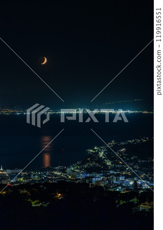 Night view from Windmill Hill in Wellington, New Zealand and a crescent moon floating in the night sky 119916551