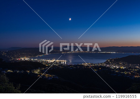 Night view from Windmill Hill in Wellington, New Zealand and a crescent moon in the morning sky 119916555