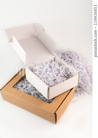 Confetti gift box filler in the box on white background 119916851